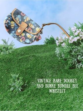 Dooney & Bourke Black Bumble Bee Print Wristlet with Tan Trim